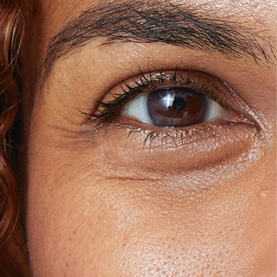 Close-up of fine lines and crow's feet around the eye - skincare for fine lines and wrinkles